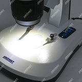 Бинокулярный стереомикроскоп AHT-34 с поворотным объективом (1x-3x) и сенсорной регулировкой яркости, светодиодами проходящего и падающего света и аккумуляторными батареями Бинокулярный стереомикроскоп AHT-34 с поворотным объективом (1x-3x) и сенсорной регулировкой яркости, светодиодами проходящего и падающего света и аккумуляторными батареями